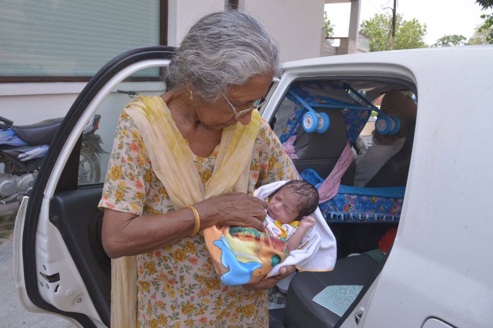 Indian mother Daljinder Kaur, 70, poses for a photograph as she holds her newborn baby boy Arman as she arrives home in Amritsar on May 11, 2016. An Indian woman who gave birth at the age of 70 said May 10 she was not too old to become a first-time mother, adding that her life was now complete. Daljinder Kaur gave birth last month to a boy following two years of IVF treatment at a fertility clinic in the northern state of Haryana with her 79-year-old husband. / AFP / NARINDER NANU (Photo credit should read NARINDER NANU/AFP/Getty Images)